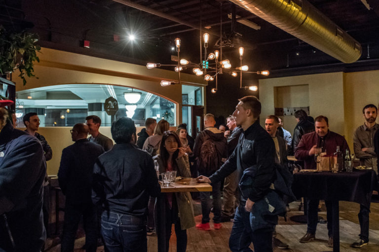 The Wright Room — interior with Edison-bulb chandeliers and attendees